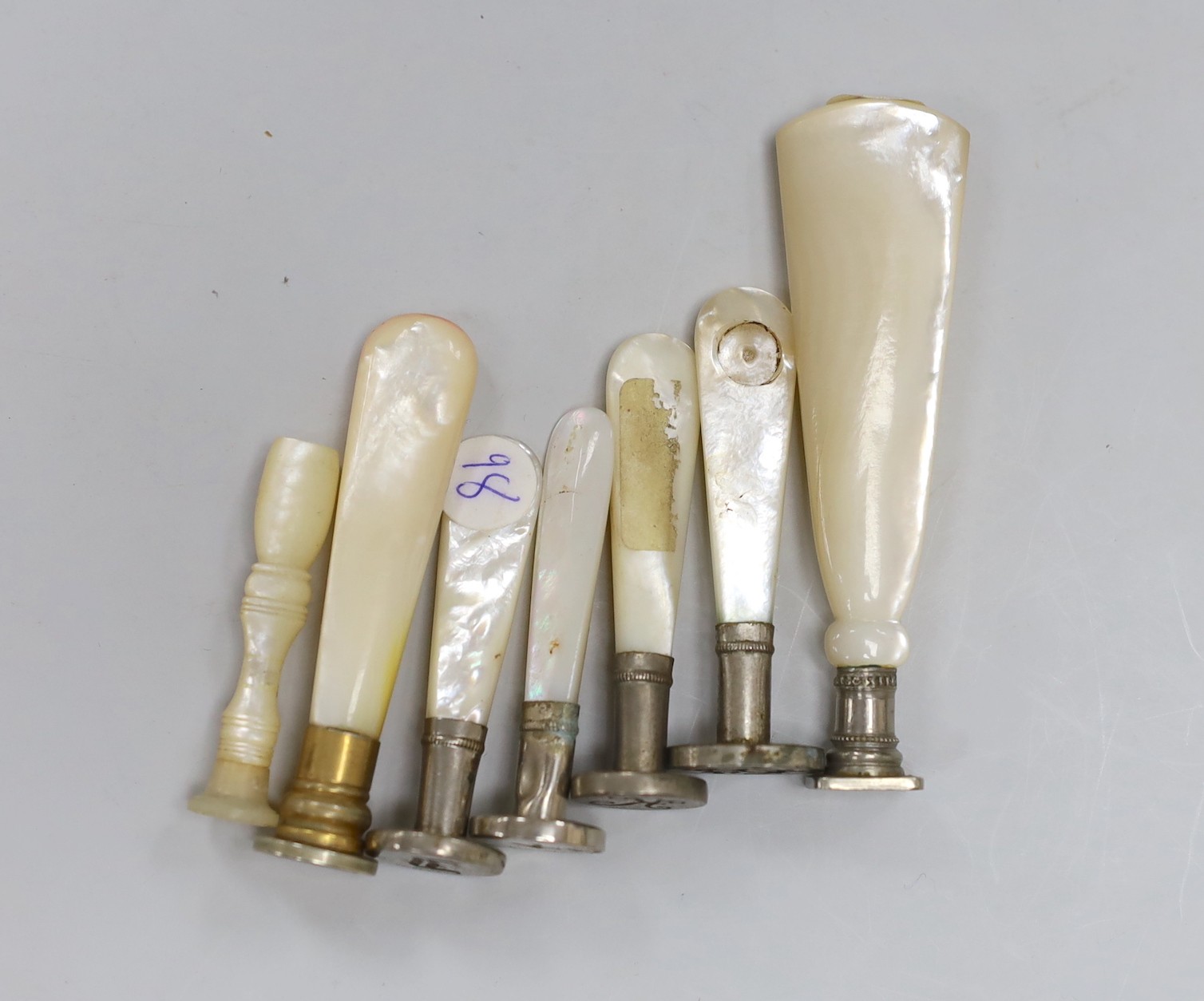 A group of seven mother of pearl mounted desk seals